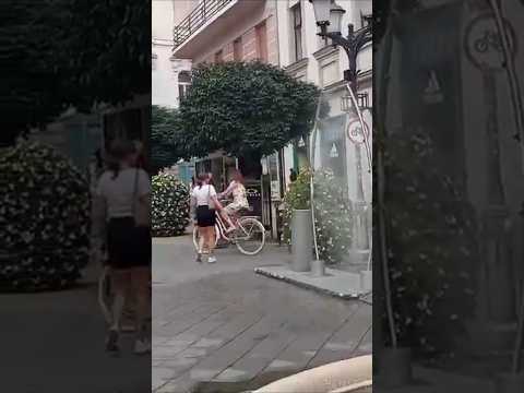 Walking the pedestrian zone with refreshing water curtain in the city of Gyor